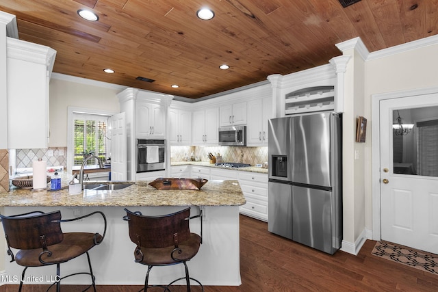 141 Whisper Lake Blvd, Madison, MS 39110 - kitchen featuring appliances with stainless steel finishes, a peninsula, white cabinets, wooden ceiling, and dark wood-type flooring
