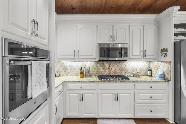 141 Whisper Lake Blvd, Madison, MS 39110 - kitchen with stainless steel appliances, white cabinets, tasteful backsplash, and wooden ceiling