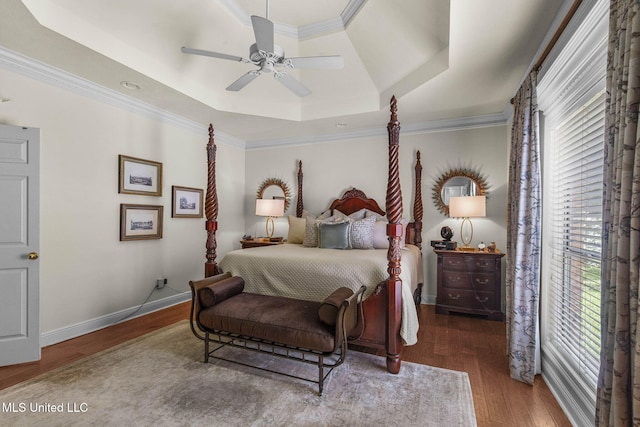 141 Whisper Lake Blvd, Madison, MS 39110 - bedroom featuring a tray ceiling, multiple windows, wood finished floors, crown molding, and a ceiling fan