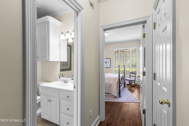 141 Whisper Lake Blvd, Madison, MS 39110 - bathroom featuring crown molding, vanity, and wood finished floors