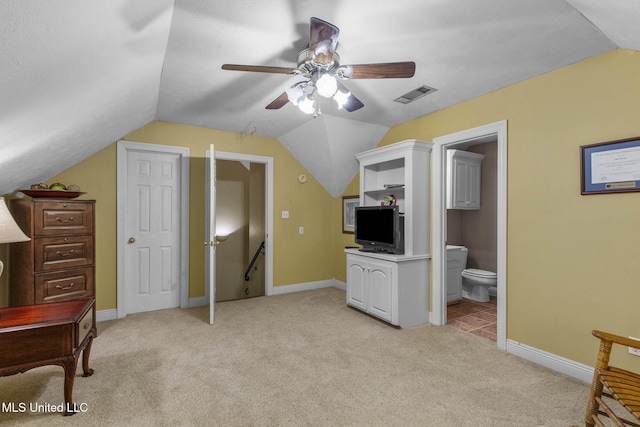 141 Whisper Lake Blvd, Madison, MS 39110 - bedroom with lofted ceiling, light colored carpet, ensuite bath, and ceiling fan