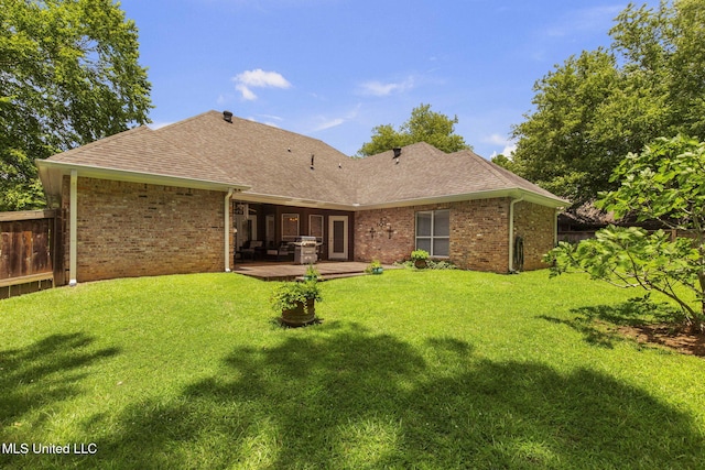 141 Whisper Lake Blvd, Madison, MS 39110 - back of house featuring a shingled roof, brick siding, and a patio area