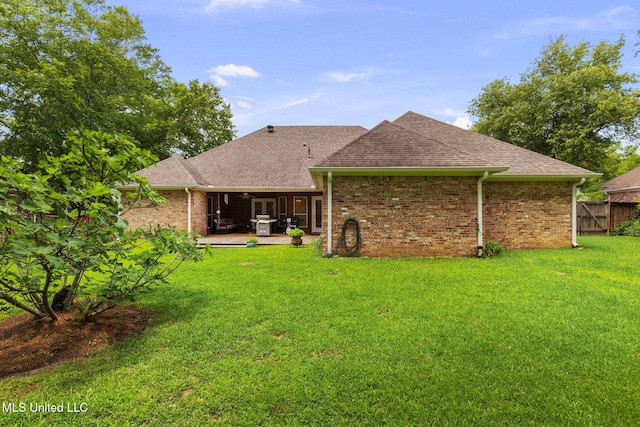 141 Whisper Lake Blvd, Madison, MS 39110 - rear view of house featuring a shingled roof and brick siding
