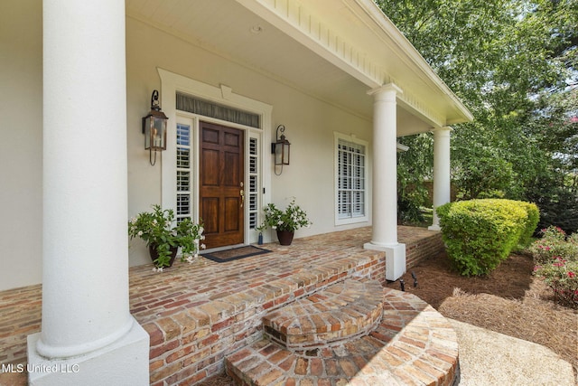 141 Whisper Lake Blvd, Madison, MS 39110 - view of exterior entry featuring covered porch and stucco siding