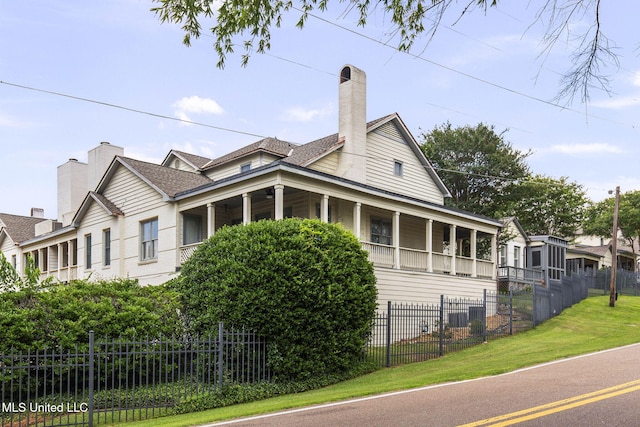 107 Lakepointe Dr, Madison, MS 39110 - view of property exterior featuring covered porch and a chimney