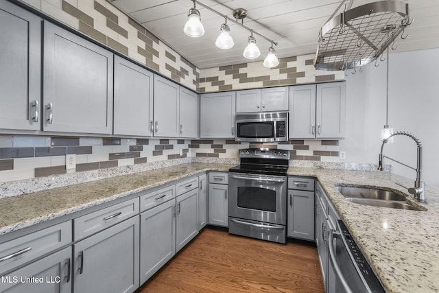 107 Lakepointe Dr, Madison, MS 39110 - kitchen featuring appliances with stainless steel finishes, a sink, gray cabinetry, light stone counters, and dark wood-style flooring