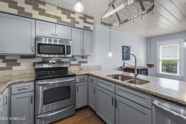 107 Lakepointe Dr, Madison, MS 39110 - kitchen with appliances with stainless steel finishes, gray cabinets, a sink, light stone countertops, and dark wood-style flooring