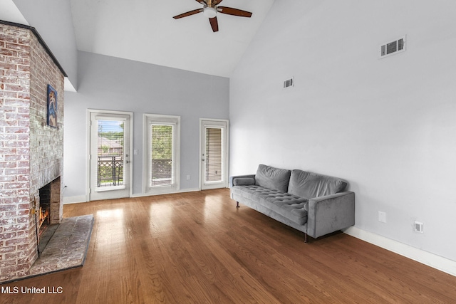 107 Lakepointe Dr, Madison, MS 39110 - sitting room with high vaulted ceiling, ceiling fan, a fireplace, wood finished floors, and baseboards