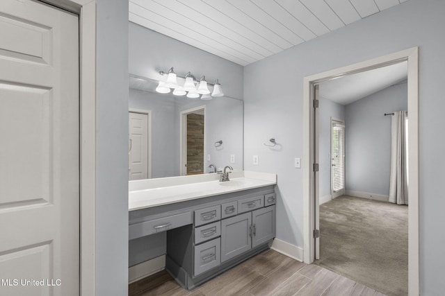 107 Lakepointe Dr, Madison, MS 39110 - bathroom featuring vanity, wood finished floors, and baseboards