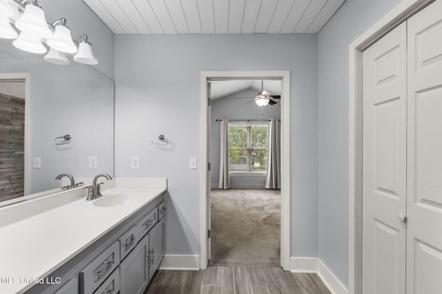 107 Lakepointe Dr, Madison, MS 39110 - bathroom with wood finished floors, vanity, a ceiling fan, baseboards, and lofted ceiling