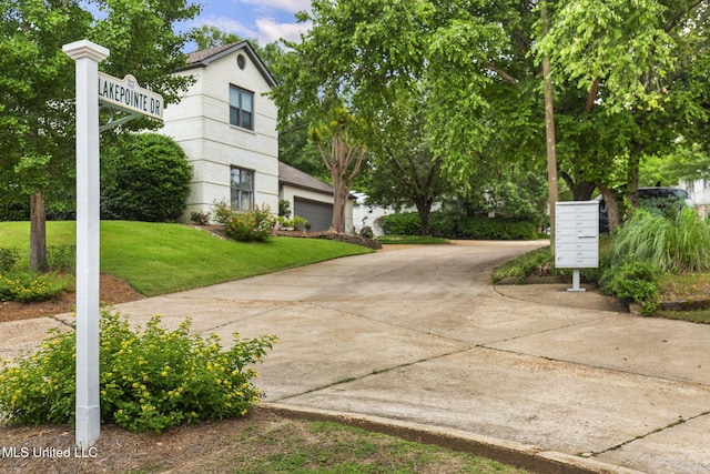 107 Lakepointe Dr, Madison, MS 39110 - view of side of property with mail area, a yard, and driveway