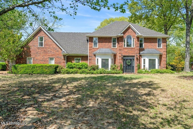 8538 Collinswood Dr, Olive Branch, MS 38654 - colonial inspired home featuring roof with shingles, a front yard, and brick siding