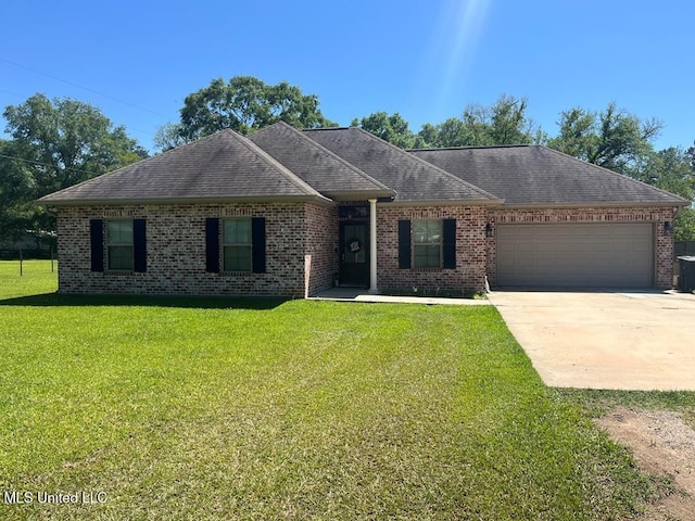 single story home featuring driveway, roof with shingles, an attached garage, a front yard, and brick siding