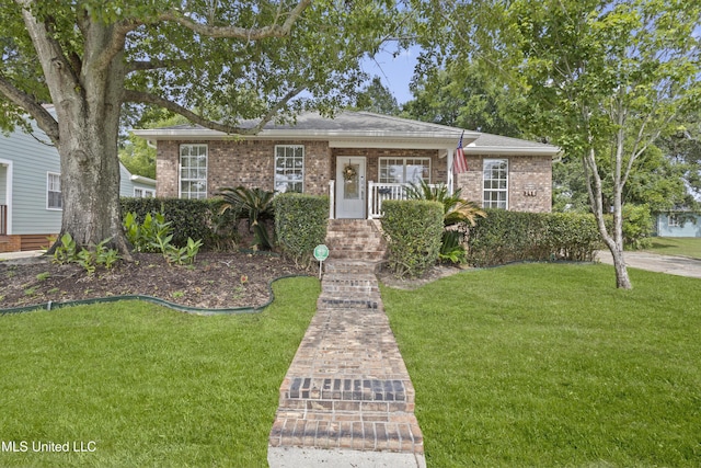 148 Acacia Ave, Biloxi, MS 39530 - view of front of property featuring a front lawn and brick siding