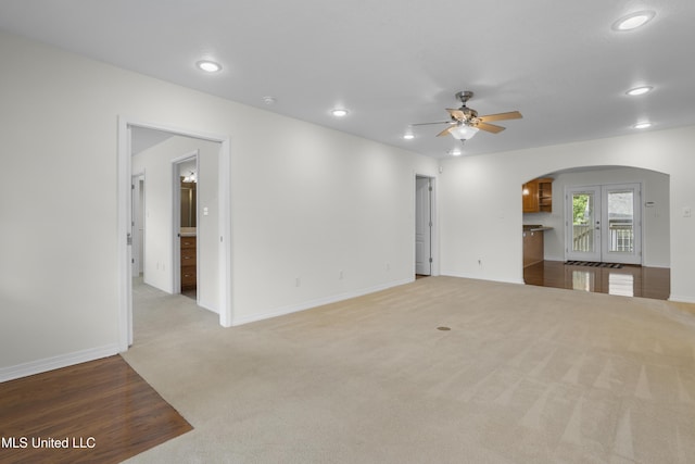 148 Acacia Ave, Biloxi, MS 39530 - unfurnished living room featuring arched walkways, a ceiling fan, recessed lighting, and carpet flooring