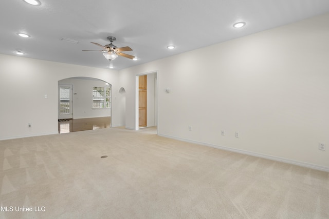 148 Acacia Ave, Biloxi, MS 39530 - empty room with arched walkways, a ceiling fan, light colored carpet, and recessed lighting