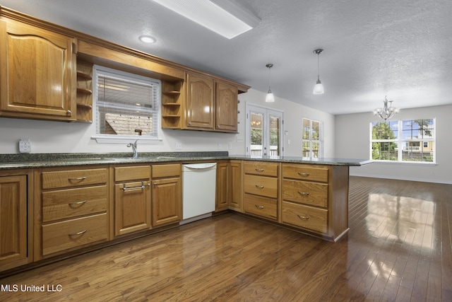 148 Acacia Ave, Biloxi, MS 39530 - kitchen featuring open shelves, white dishwasher, a peninsula, dark wood-type flooring, and a chandelier