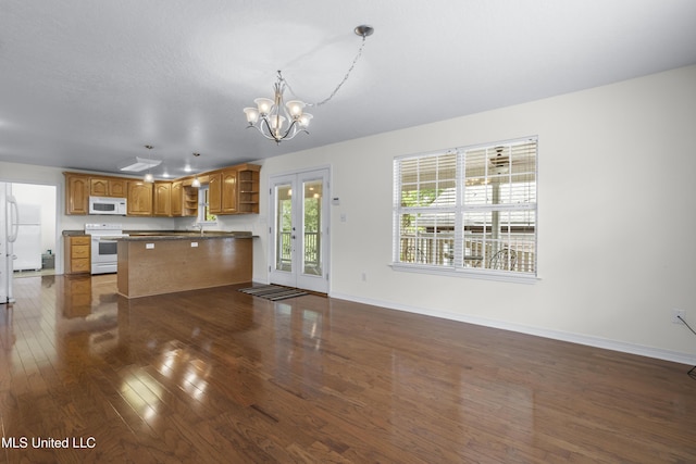 148 Acacia Ave, Biloxi, MS 39530 - kitchen featuring white appliances, open shelves, dark wood-style floors, a chandelier, and dark countertops