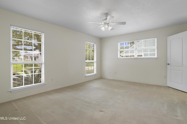148 Acacia Ave, Biloxi, MS 39530 - empty room with carpet flooring, a ceiling fan, and a textured ceiling