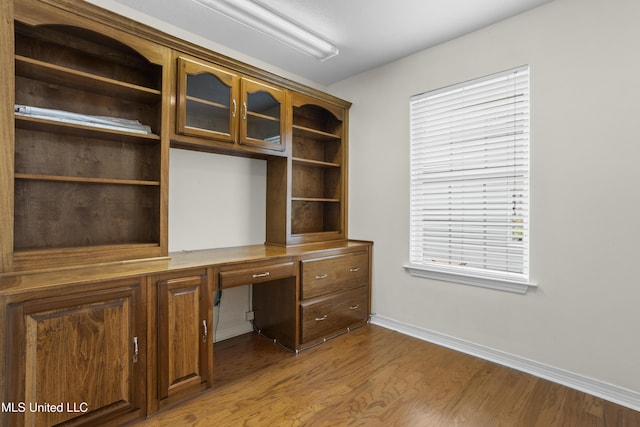 148 Acacia Ave, Biloxi, MS 39530 - unfurnished office featuring built in study area and wood finished floors