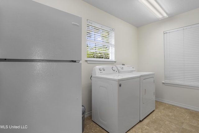 148 Acacia Ave, Biloxi, MS 39530 - laundry area featuring washing machine and dryer and baseboards