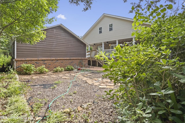 148 Acacia Ave, Biloxi, MS 39530 - rear view of house featuring stairs and brick siding