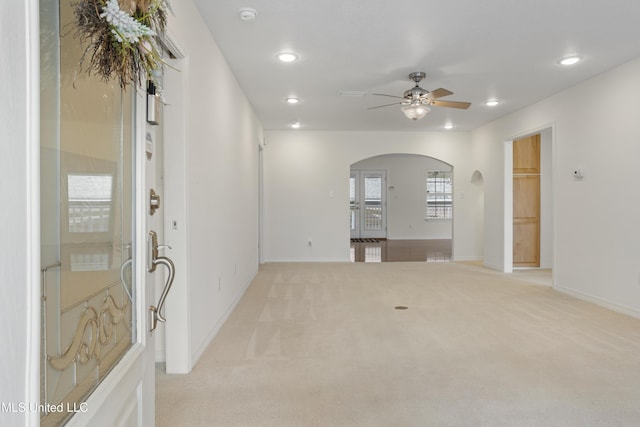148 Acacia Ave, Biloxi, MS 39530 - unfurnished room featuring arched walkways, a smoke detector, ceiling fan, recessed lighting, and light carpet