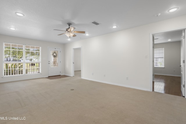 148 Acacia Ave, Biloxi, MS 39530 - empty room with light carpet, ceiling fan, recessed lighting, and a smoke detector