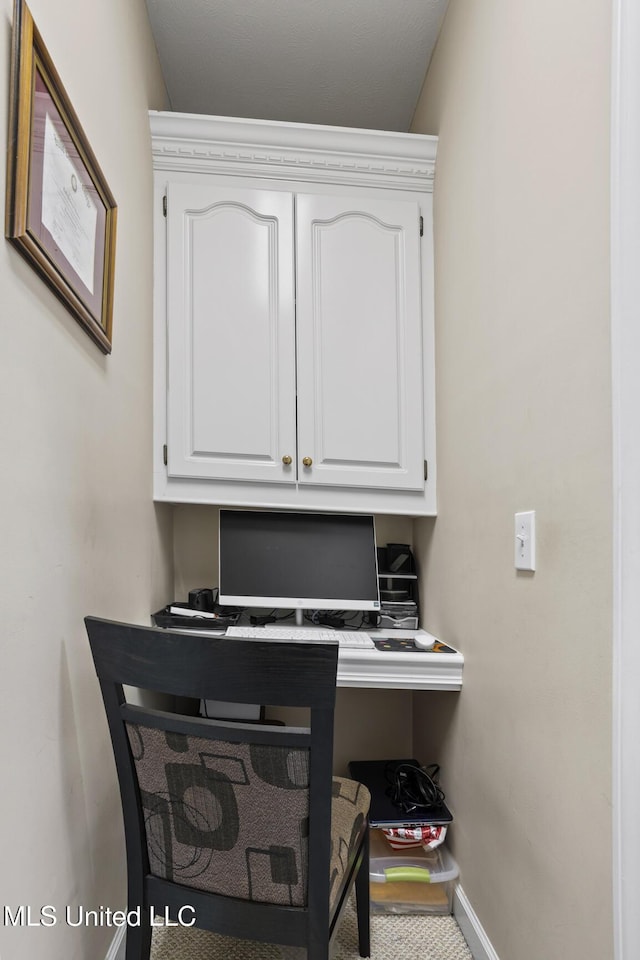 office space featuring baseboards