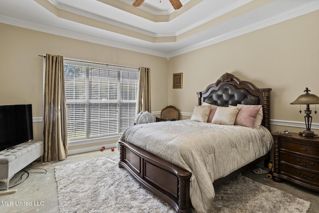 bedroom featuring crown molding, a raised ceiling, and ceiling fan