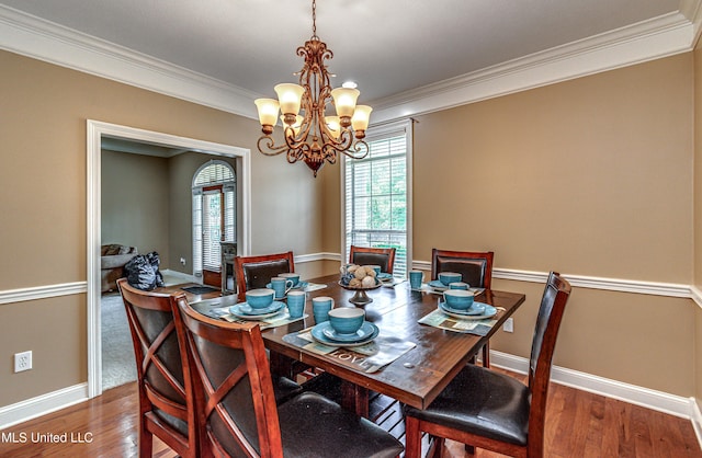 350 Edgewood Xing, Brandon, MS 39042 - dining space featuring crown molding, a chandelier, and wood finished floors
