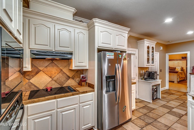 350 Edgewood Xing, Brandon, MS 39042 - kitchen with black appliances, ornamental molding, decorative backsplash, recessed lighting, and glass insert cabinets