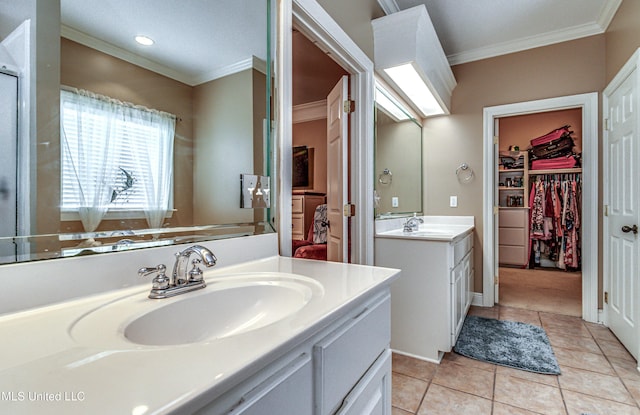 350 Edgewood Xing, Brandon, MS 39042 - bathroom with ornamental molding, two vanities, tile patterned floors, a walk in closet, and recessed lighting