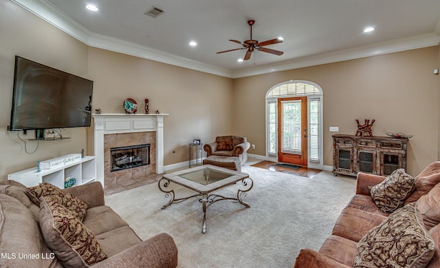 350 Edgewood Xing, Brandon, MS 39042 - carpeted living room with ceiling fan, a tile fireplace, crown molding, and recessed lighting