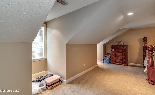 350 Edgewood Xing, Brandon, MS 39042 - additional living space with lofted ceiling, carpet flooring, and a textured ceiling