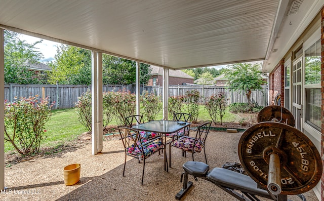 350 Edgewood Xing, Brandon, MS 39042 - fenced backyard with a patio area and outdoor dining space