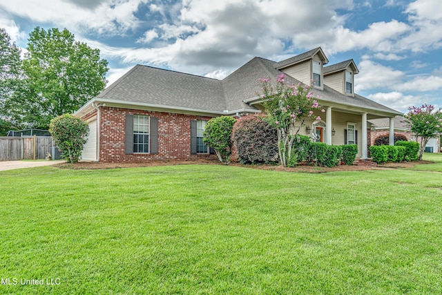 350 Edgewood Xing, Brandon, MS 39042 - view of front of house featuring a shingled roof, brick siding, a garage, a porch, and concrete driveway