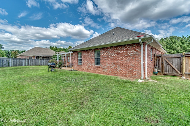 350 Edgewood Xing, Brandon, MS 39042 - back of property with brick siding, roof with shingles, and a fenced backyard