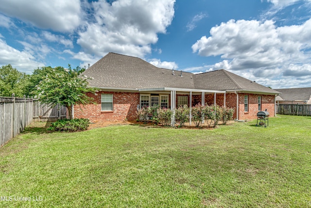 350 Edgewood Xing, Brandon, MS 39042 - rear view of house featuring brick siding, a fenced backyard, and roof with shingles