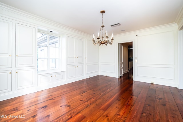 unfurnished dining area featuring an inviting chandelier, visible vents, a decorative wall, crown molding, and dark wood-type flooring