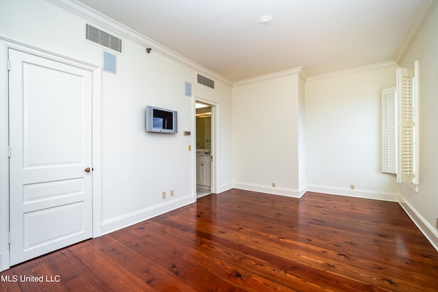 unfurnished room featuring ornamental molding and dark hardwood / wood-style flooring