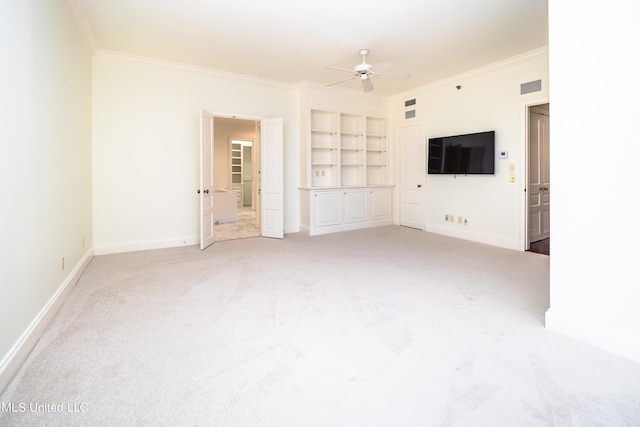 unfurnished living room featuring carpet flooring and ornamental molding