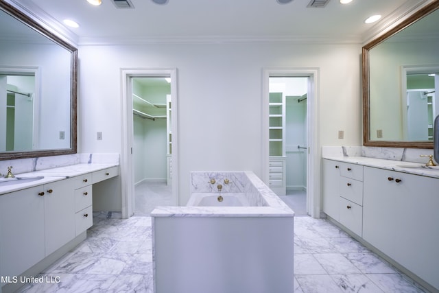 bathroom featuring crown molding, marble finish floor, two vanities, and recessed lighting
