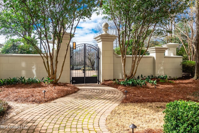 view of gate featuring fence