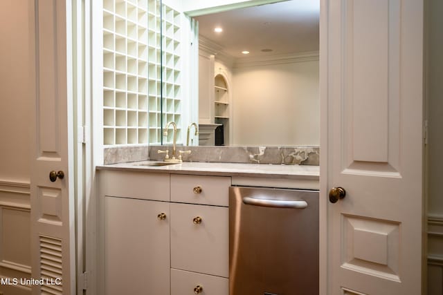 bar with ornamental molding, recessed lighting, and a sink
