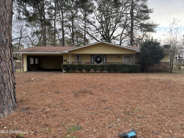 ranch-style home with a carport