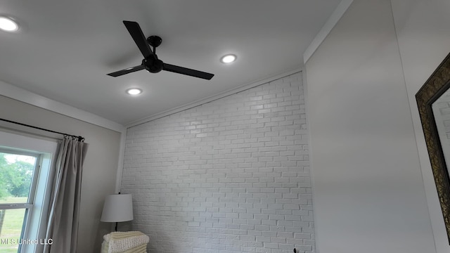 interior details featuring ornamental molding and ceiling fan