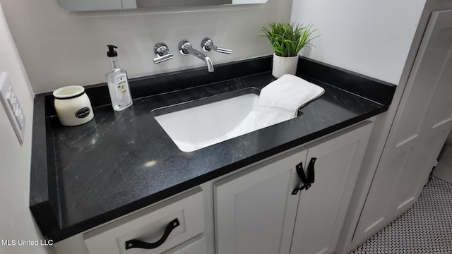 bathroom with vanity and tile patterned floors