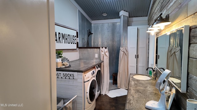 laundry room with washer and dryer and sink