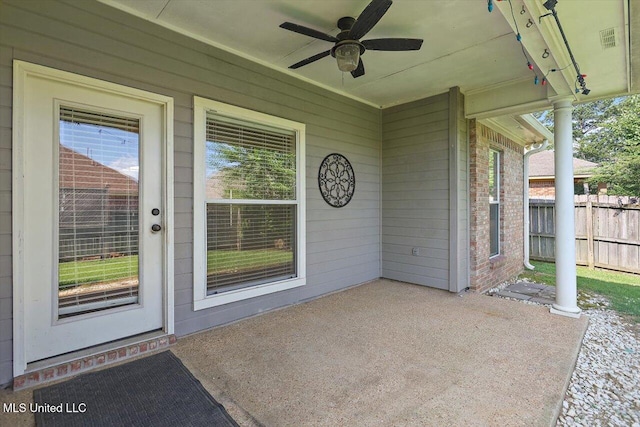 508 Oakleigh Pl, Brandon, MS 39047 - view of exterior entry with a ceiling fan, a patio area, and brick siding